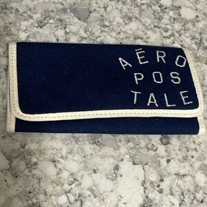 Aeropostale wallet, space for 4 Credit cards and ID. Made of fabric. New